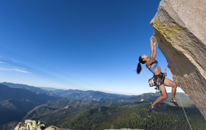 Rock climber dangling.